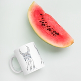 Sacred Geometry Feather Mug with watermelon for scale