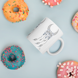 Sacred Geometry Feather Mug with donuts for scale